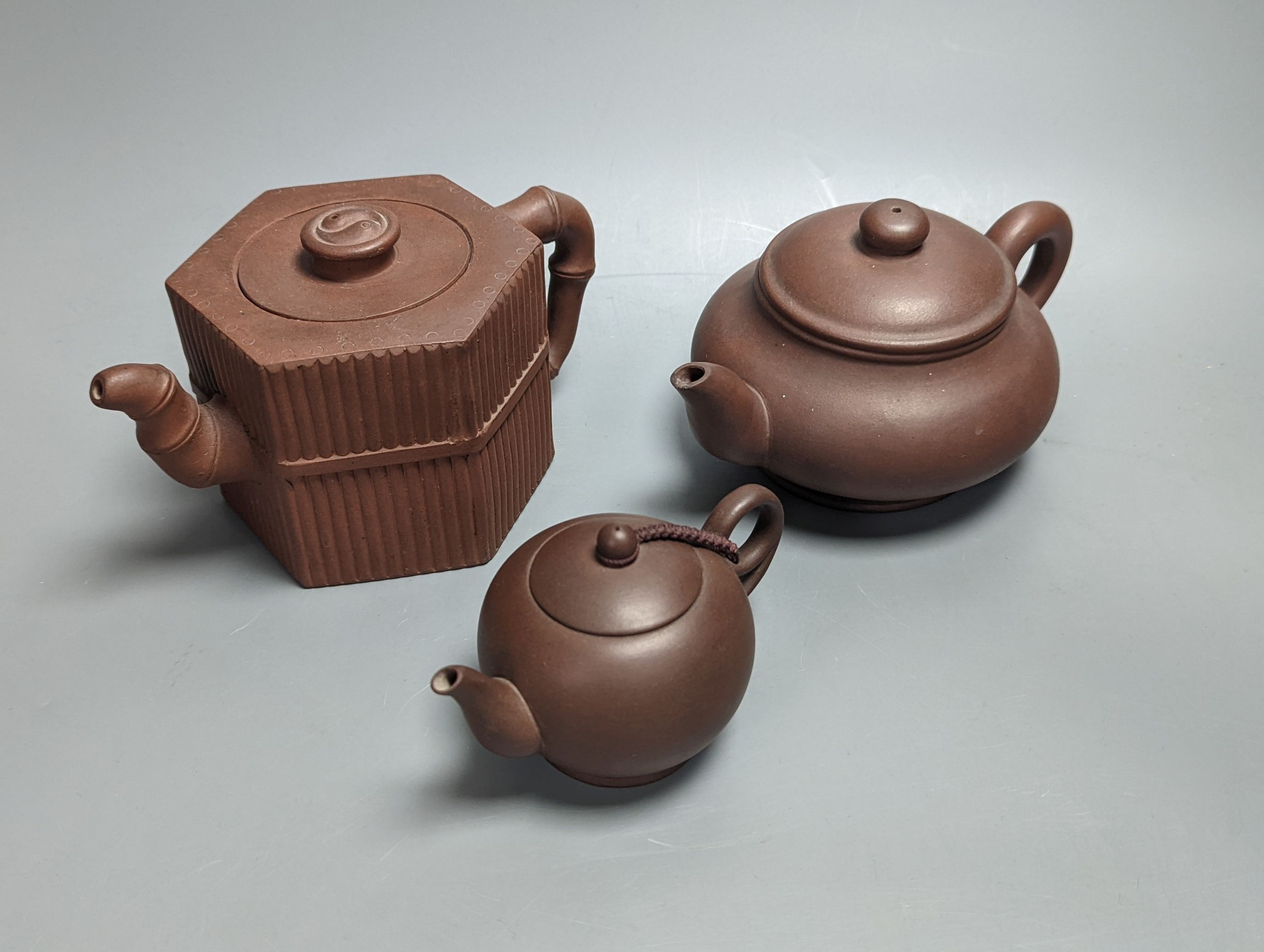 Three Chinese Yixing teapots, tallest 10.5cm